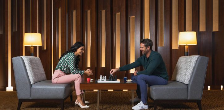 couple-playing-chess-in-yasmine-lounge-min-2